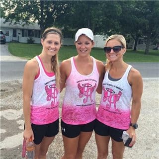 A picture of three woman wearing white tanks
