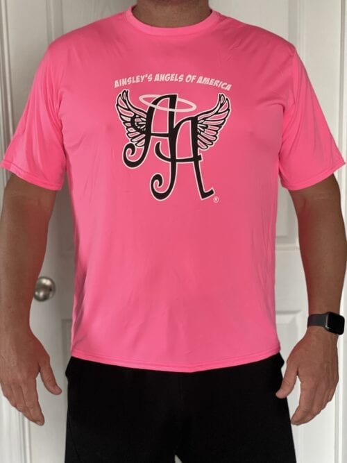 pink shirt with Ainsley’s Angels of America’s logo in front