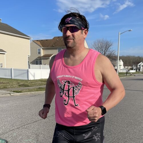 A picture of a man wearing pink sleeveless