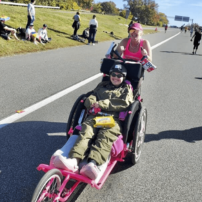 Sylvia pushing Stacia at Marine Corps Marathon
